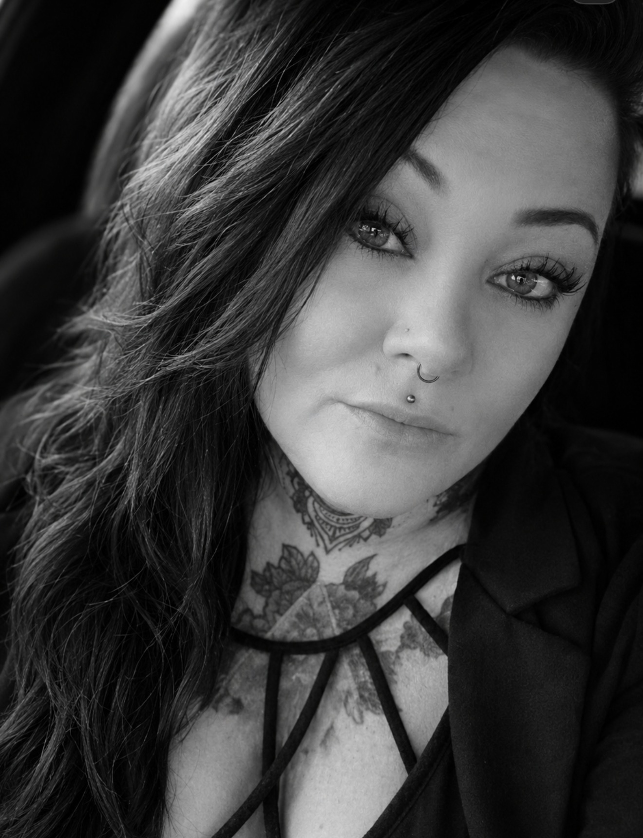 Ona Renae — author portrait with long hair and neck tattoos